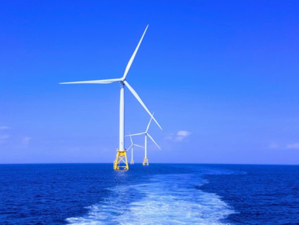 offshore wind turbines with blue sky