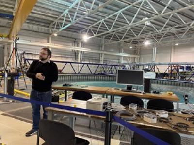 FloWave’s Principal Experimental Officer, Thomas Davey, gives a tour of the facility to University of Edinburgh Students Image if FloWave Thomas Davey
