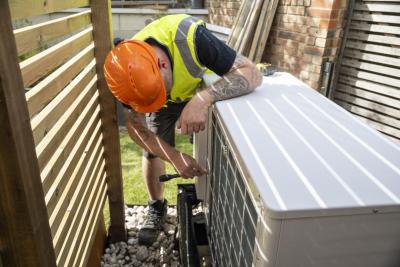 Engineering working on a heat pump